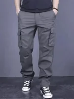 Men's casual multi pocket work pants with loose fit and drawstring waistband suitable for hikingfishingand outdoor exploration